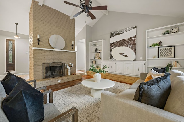 13007 Stillforest St, Austin, TX 78729 - living room featuring high vaulted ceiling, a ceiling fan, beam ceiling, built in features, and a brick fireplace