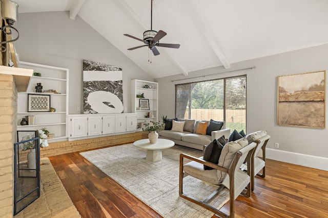 13007 Stillforest St, Austin, TX 78729 - living area with beamed ceiling, wood-type flooring, a ceiling fan, high vaulted ceiling, and baseboards