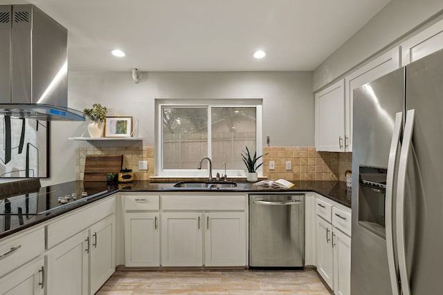 13007 Stillforest St, Austin, TX 78729 - kitchen featuring appliances with stainless steel finishes, a sink, tasteful backsplash, white cabinetry, and recessed lighting
