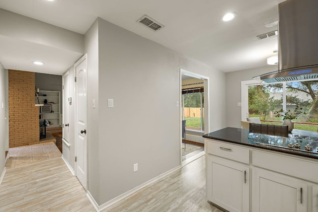 13007 Stillforest St, Austin, TX 78729 - hallway with recessed lighting, light wood-style floors, and baseboards