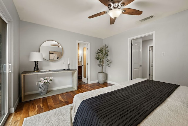 13007 Stillforest St, Austin, TX 78729 - bedroom featuring wood finished floors, baseboards, a ceiling fan, and ensuite bathroom