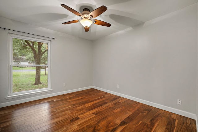 13007 Stillforest St, Austin, TX 78729 - spare room with baseboards, a ceiling fan, and dark wood-style flooring