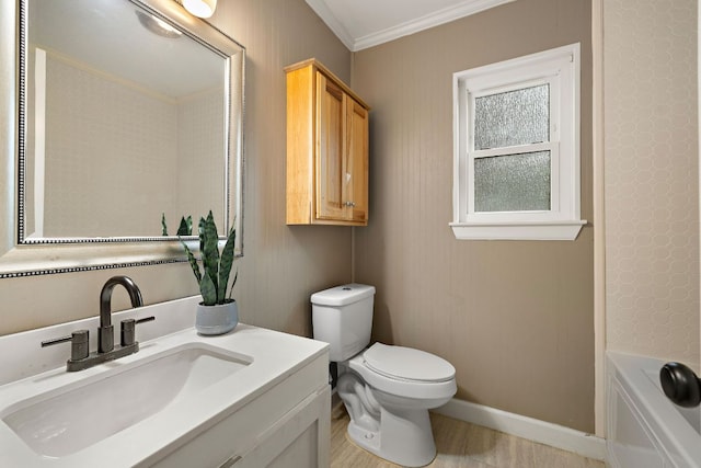 13007 Stillforest St, Austin, TX 78729 - full bathroom featuring vanity, toilet, crown molding, a bathtub, and baseboards