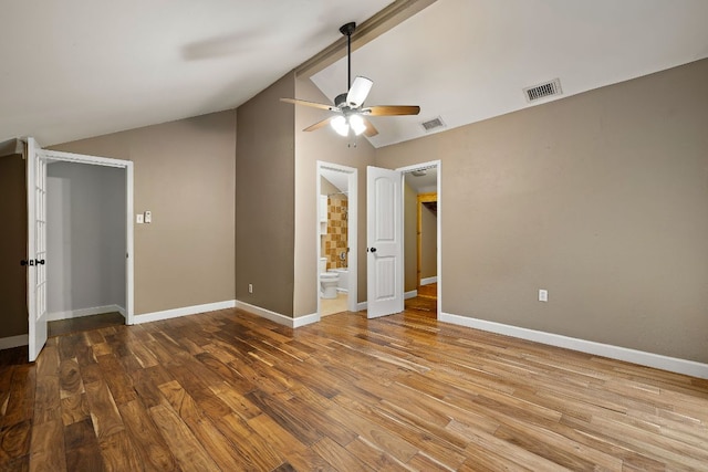 13007 Stillforest St, Austin, TX 78729 - unfurnished room with ceiling fan, lofted ceiling, wood finished floors, and baseboards