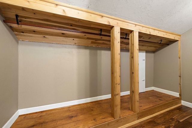 13007 Stillforest St, Austin, TX 78729 - finished basement with wood finished floors and baseboards
