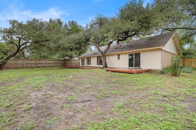 13007 Stillforest St, Austin, TX 78729 - back of house with a wooden deck