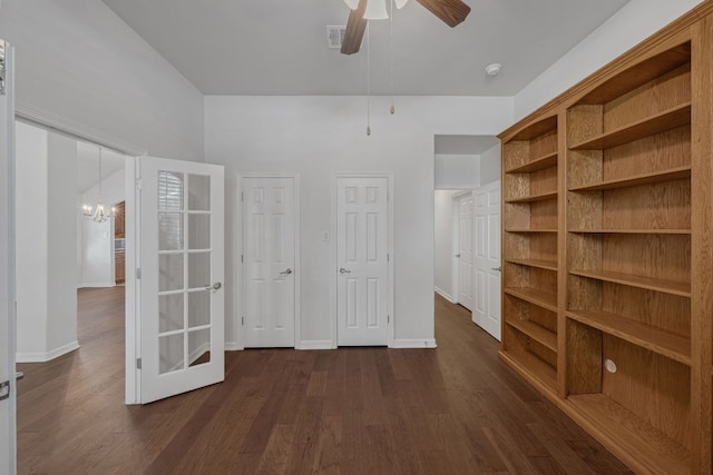 20700 Windmill Ridge St, Pflugerville, TX 78660 - unfurnished bedroom with dark wood finished floors and a chandelier