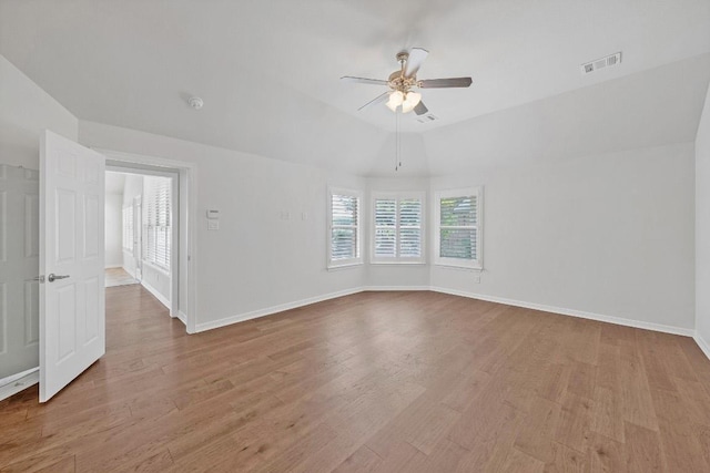 20700 Windmill Ridge St, Pflugerville, TX 78660 - unfurnished room with a ceiling fan, plenty of natural light, wood finished floors, and a smoke detector