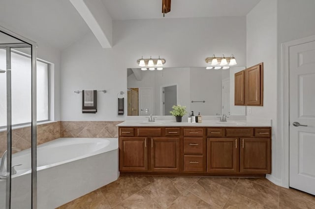 20700 Windmill Ridge St, Pflugerville, TX 78660 - bathroom with a garden tub, double vanity, a stall shower, and tile patterned floors