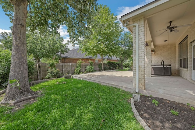 20700 Windmill Ridge St, Pflugerville, TX 78660 - fenced backyard featuring a patio and ceiling fan