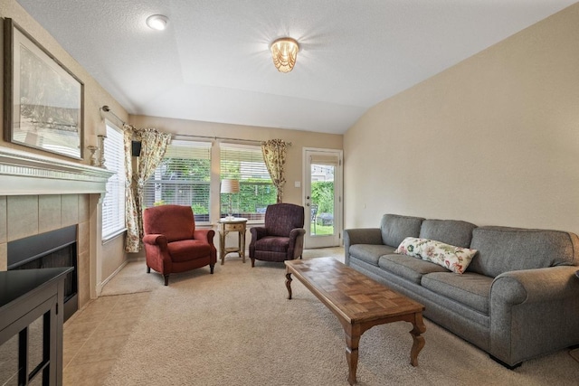 11208 Persimmon Gap Dr, Austin, TX 78717 - living area with healthy amount of natural light, a tiled fireplace, and light colored carpet