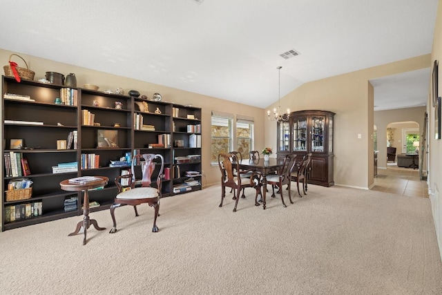 11208 Persimmon Gap Dr, Austin, TX 78717 - dining area featuring light colored carpet, a chandelier, arched walkways, healthy amount of natural light, and vaulted ceiling