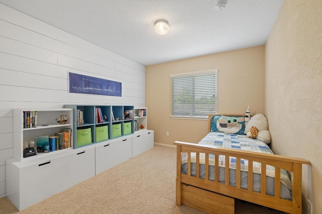 11208 Persimmon Gap Dr, Austin, TX 78717 - bedroom featuring carpet floors, a textured ceiling, and wood walls