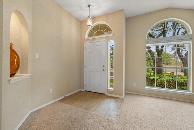 11208 Persimmon Gap Dr, Austin, TX 78717 - carpeted entryway with tile patterned floors, baseboards, vaulted ceiling, arched walkways, and a chandelier