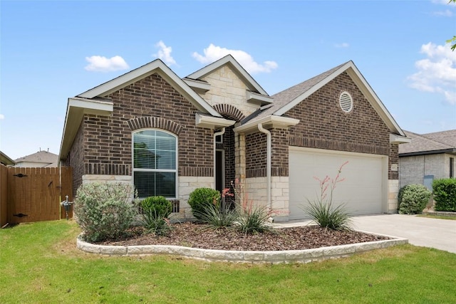 605 Bridle Creek Dr, Georgetown, TX 78626 - french country style house with brick siding, an attached garage, driveway, and stone siding