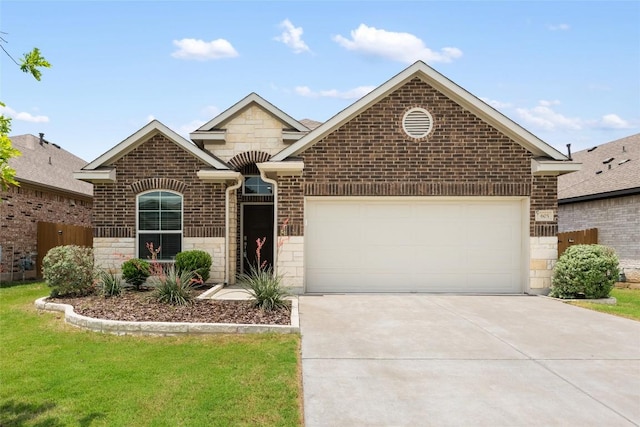 605 Bridle Creek Dr, Georgetown, TX 78626 - french country home featuring driveway, a garage, stone siding, and brick siding