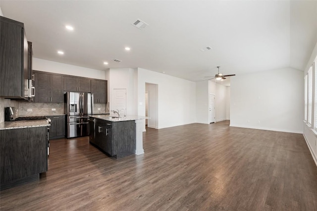 605 Bridle Creek Dr, Georgetown, TX 78626 - kitchen featuring stainless steel appliances, a ceiling fan, decorative backsplash, a center island with sink, and a sink