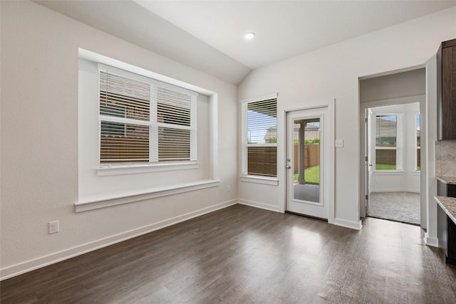 605 Bridle Creek Dr, Georgetown, TX 78626 - spare room with dark wood-style floors, vaulted ceiling, and baseboards