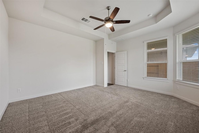 605 Bridle Creek Dr, Georgetown, TX 78626 - spare room featuring ceiling fan, carpet, baseboards, and a raised ceiling