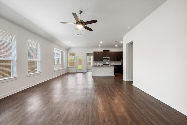 605 Bridle Creek Dr, Georgetown, TX 78626 - unfurnished living room featuring ceiling fan, dark wood-style floors, baseboards, and recessed lighting