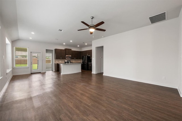 605 Bridle Creek Dr, Georgetown, TX 78626 - unfurnished living room featuring a ceiling fan, dark wood finished floors, baseboards, recessed lighting, and lofted ceiling