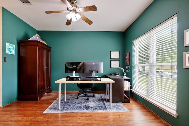 17121 Bishopsgate Dr, Pflugerville, TX 78660 - office area featuring healthy amount of natural light, wood finished floors, ceiling fan, and baseboards