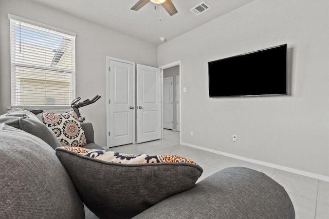 299 Fabion St, Kyle, TX 78640 - living area with light tile patterned floors and ceiling fan