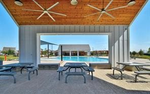 299 Fabion St, Kyle, TX 78640 - view of patio / terrace featuring ceiling fan and an outdoor pool