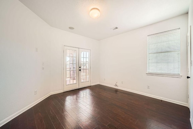 9812 Whitley Bay Dr, Austin, TX 78717 - unfurnished room with french doors, baseboards, and dark wood-style floors