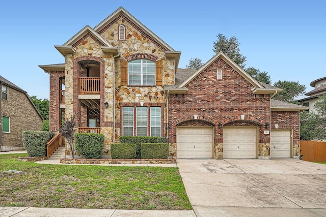 9812 Whitley Bay Dr, Austin, TX 78717 - view of front of home with driveway, stone siding, brick siding, and an attached garage