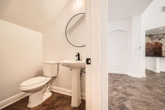 9812 Whitley Bay Dr, Austin, TX 78717 - bathroom with toilet, baseboards, and a sink