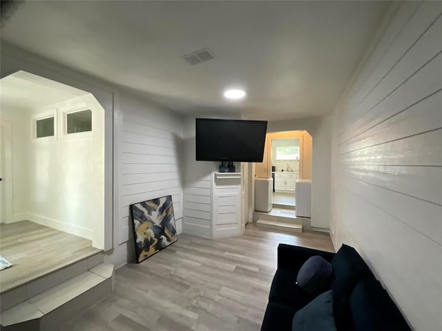 14902 Nuttall Dr, Austin, TX 78724 - living room with wood walls and light wood finished floors