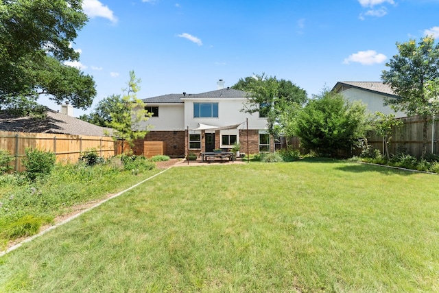 11542 Gun Fight Ln, Austin, TX 78748 - back of property with brick siding and a patio
