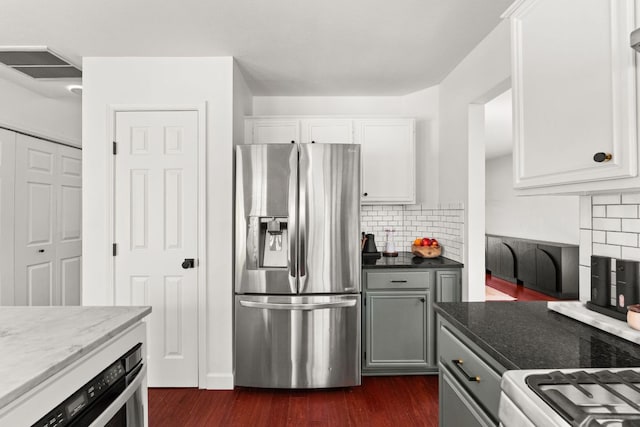 11542 Gun Fight Ln, Austin, TX 78748 - kitchen featuring stainless steel fridge, dark wood-style floors, dark stone counters, white cabinetry, and tasteful backsplash