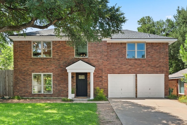 11542 Gun Fight Ln, Austin, TX 78748 - view of front of property with concrete driveway, a garage, and brick siding