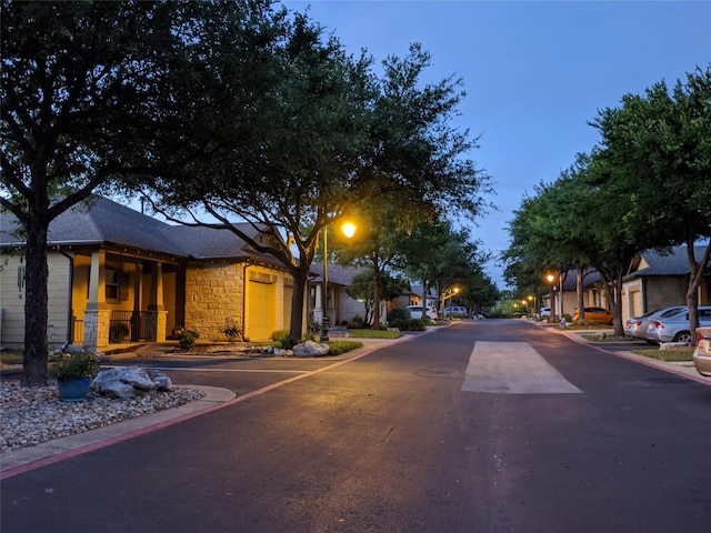 6801 Beckett Rd Unit 119L, Austin, TX 78749 - view of asphalt road featuring curbs and a residential view