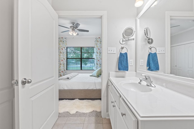 6801 Beckett Rd Unit 119L, Austin, TX 78749 - bathroom with crown molding, vanity, ceiling fan, and tile patterned floors