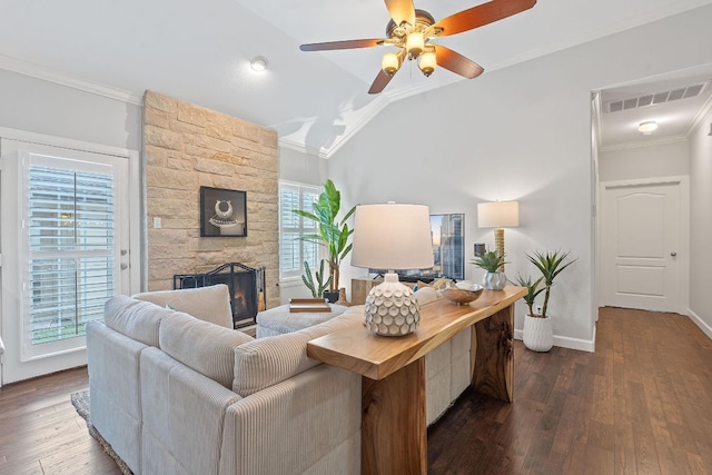 6801 Beckett Rd Unit 119L, Austin, TX 78749 - living area with ornamental molding, dark wood-style floors, a stone fireplace, ceiling fan, and vaulted ceiling