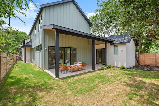 517 Tillery St Unit 3, Austin, TX 78702 - rear view of property with a patio, an outdoor living space, cooling unit, and board and batten siding
