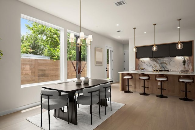 517 Tillery St Unit 3, Austin, TX 78702 - dining space with light wood-style flooring, recessed lighting, and baseboards