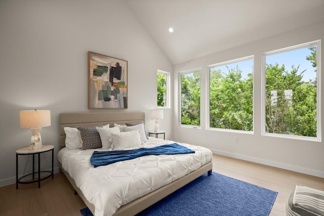 517 Tillery St Unit 3, Austin, TX 78702 - bedroom featuring recessed lighting, baseboards, wood finished floors, and lofted ceiling