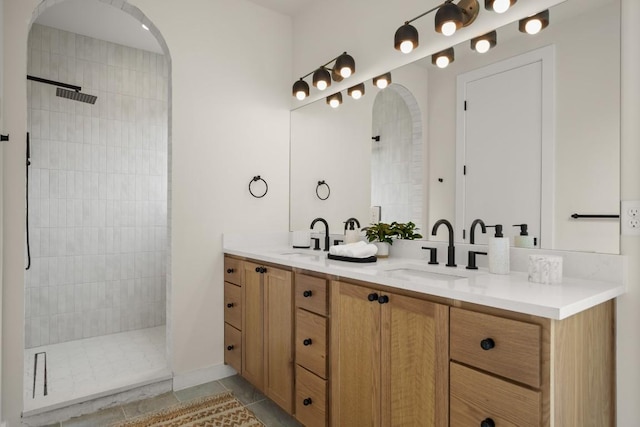 517 Tillery St Unit 3, Austin, TX 78702 - full bathroom with double vanity, walk in shower, and tile patterned floors