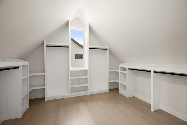 517 Tillery St Unit 3, Austin, TX 78702 - walk in closet featuring light wood finished floors and lofted ceiling