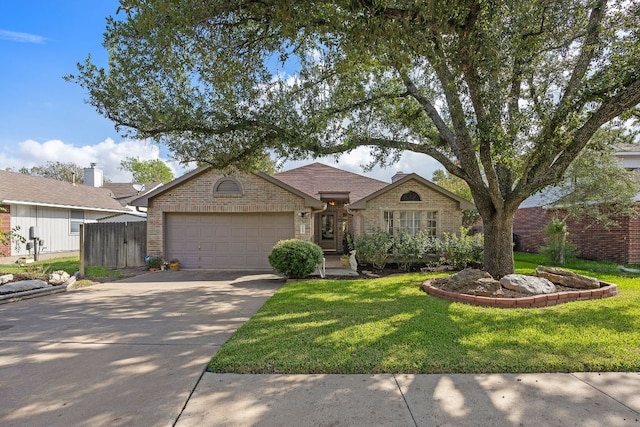 2506 Jacqueline Dr, Leander, TX 78641 - view of front of home featuring an attached garage, brick siding, and driveway