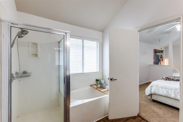 205 Tolcarne Dr, Hutto, TX 78634 - bathroom featuring a shower stall, a garden tub, and vaulted ceiling