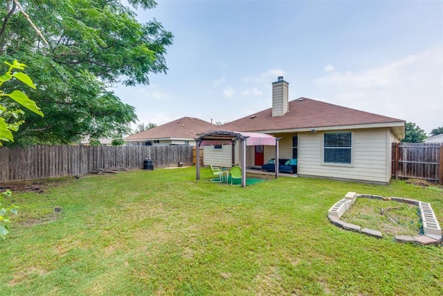 205 Tolcarne Dr, Hutto, TX 78634 - rear view of house featuring a chimney