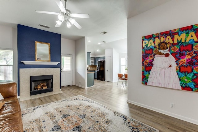 205 Tolcarne Dr, Hutto, TX 78634 - unfurnished living room with ceiling fan, light wood-type flooring, and baseboards