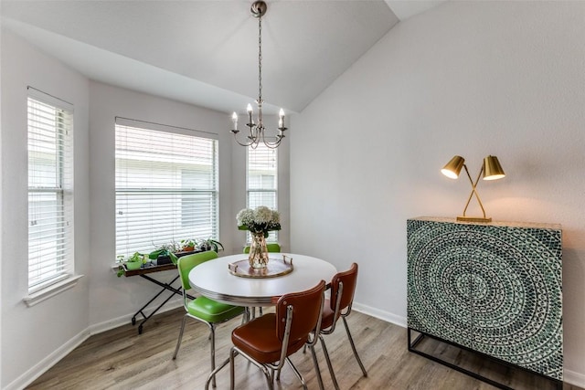205 Tolcarne Dr, Hutto, TX 78634 - dining room with light wood finished floors, plenty of natural light, a chandelier, and lofted ceiling
