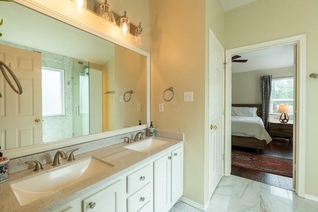 1818 W Pflugerville Pkwy, Round Rock, TX 78664 - bathroom with double vanity, marble finish floors, connected bathroom, and a shower stall