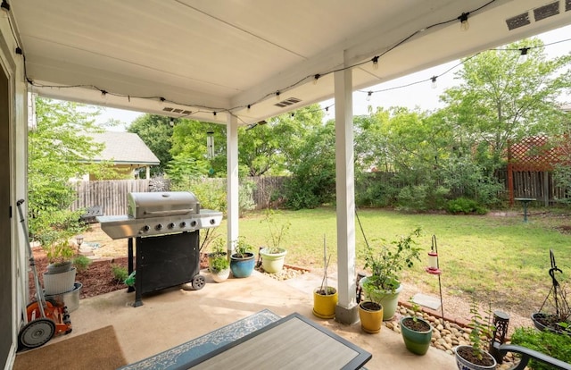 1818 W Pflugerville Pkwy, Round Rock, TX 78664 - fenced backyard with grilling area and a patio area